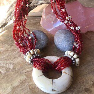 Vintage Multi-stranded beaded Necklace with Carved Bovine Pendant.